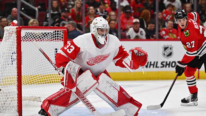 Oct 1, 2022; Chicago, Illinois, USA;  Detroit Red Wings goaltender Sebastian Cossa (33) defends the net against the Chicago Blackhawks at United Center. Mandatory Credit: Jamie Sabau-Imagn Images