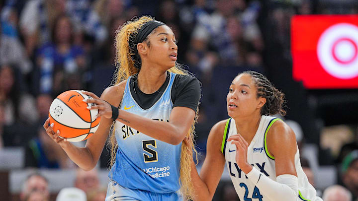 Jul 22, 2025; Minneapolis, Minnesota, USA; Minnesota Lynx forward Napheesa Collier (24) defends Chicago Sky forward Angel Reese (5) in the fourth quarter at Target Center. Mandatory Credit: Brad Rempel-Imagn Images