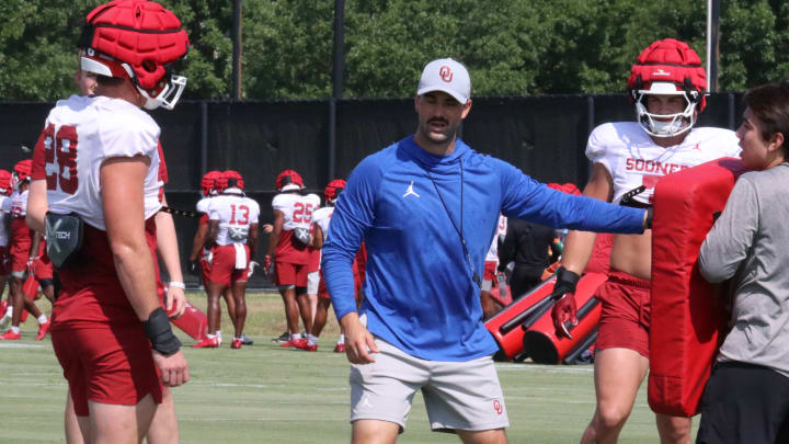 Oklahoma defensive coordinator Zac Alley working with the linebackers at OU practice during fall camp.