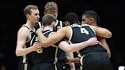 The starting five for the Purdue Boilermakers huddle up against the Houston Cougars 