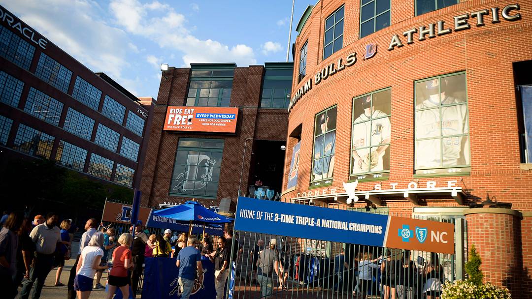 Fans enter the stadium on game day at Durham Bulls Athletic Park in Durham, North Carolina, on Tuesday, Sept. 20, 2022.
