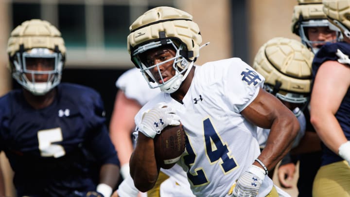 Notre Dame running back Jadarian Price runs the ball up the field during a Notre Dame football practice at Irish Athletic Center on Thursday, Aug. 1, 2024, in South Bend.