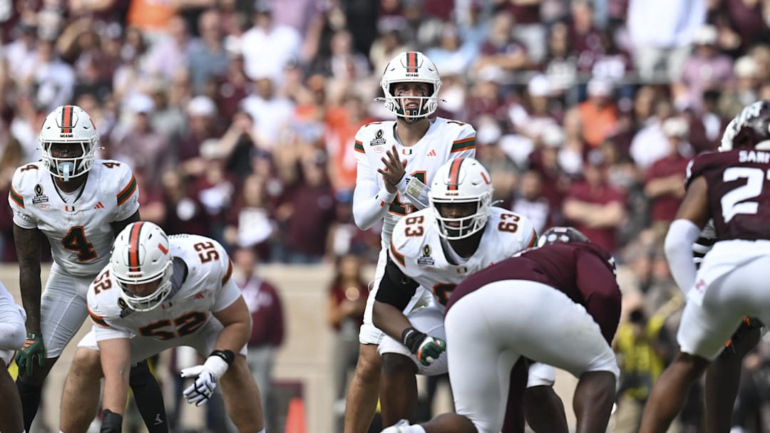 Dec 20, 2025; College Station, TX, USA; Miami Hurricanes quarterback Carson Beck (11) call the play during the first half of the first round game of the CFP National Playoff against the Texas A&M Aggies at Kyle Field. Mandatory Credit: Maria Lysaker-Imagn Images