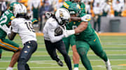 Nov 1, 2025; Waco, Texas, USA; UCF Knights wide receiver Duane Thomas Jr. (7) is tackled by Baylor Bears defensive lineman Jackie Marshall (0) during the first half at McLane Stadium. Mandatory Credit: Raymond Carlin III-Imagn Images