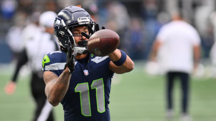 Oct 22, 2023; Seattle, Washington, USA; Seattle Seahawks wide receiver Jaxon Smith-Njigba (11) catches a pass during pregame warmups prior to the game against the Arizona Cardinals at Lumen Field. Mandatory Credit: Steven Bisig-USA TODAY Sports