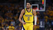 May 27, 2025; Indianapolis, Indiana, USA; Indiana Pacers guard Tyrese Haliburton (0) reacts after shooting a three point basket during the second quarter against the New York Knicks of game four of the eastern conference finals for the 2025 NBA Playoffs at Gainbridge Fieldhouse. Mandatory Credit: Trevor Ruszkowski-Imagn Images