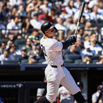 Sep 15, 2024; Bronx, New York, USA;  New York Yankees center fielder Aaron Judge (99) hits a two-run home run in the third inning against the Boston Red Sox at Yankee Stadium.