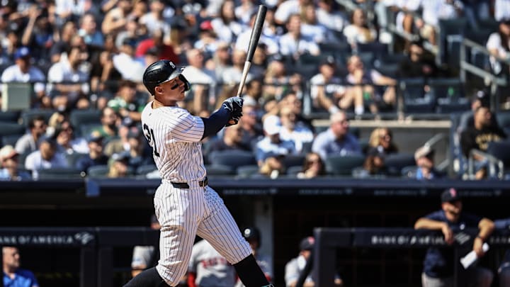 Sep 15, 2024; Bronx, New York, USA;  New York Yankees center fielder Aaron Judge (99) hits a two-run home run in the third inning against the Boston Red Sox at Yankee Stadium.