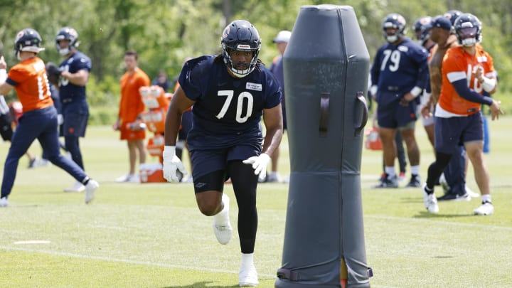 Chicago Bears tackle Braxton Jones approaches the dummy to throw a block at minicamp. PFF has ranked the Bears offensive line 11th overall.