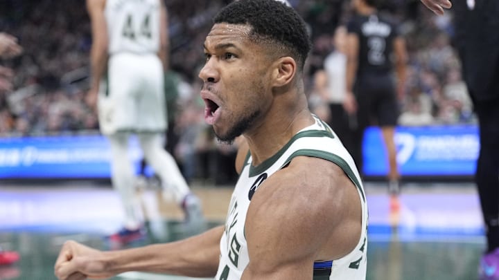 Jan 2, 2025; Milwaukee, Wisconsin, USA; Milwaukee Bucks forward Giannis Antetokounmpo (34) reacts after being fouled driving to the basket against the Brooklyn Nets in the first halfat Fiserv Forum. Mandatory Credit: Michael McLoone-Imagn Images