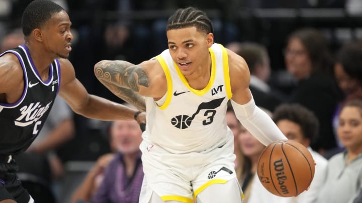 Mar 31, 2024; Sacramento, California, USA; Utah Jazz guard Keyonte George (3) dribbles against Sacramento Kings guard De'Aaron Fox (left) during the first quarter at Golden 1 Center. Mandatory Credit: Darren Yamashita-USA TODAY Sports