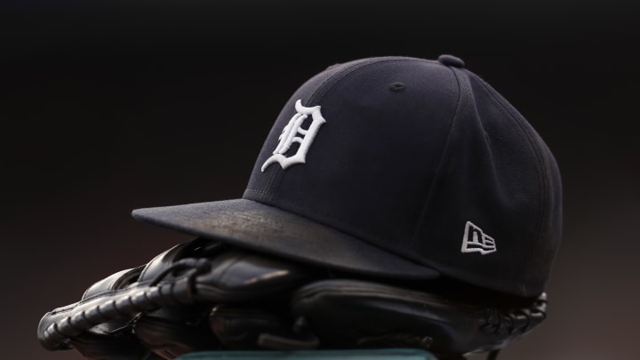 Jul 30, 2021; Detroit, Michigan, USA; The hat and glove of Detroit Tigers right fielder Robbie Grossman (8) sits on the ledge of the dugout during the first inning against the Baltimore Orioles at Comerica Park. Mandatory Credit: Raj Mehta-USA TODAY Sports