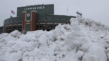 Snow is seen piled up on Wednesday, April 3, 2024, at Lambeau Field in Green Bay, Wis. A winter storm system that began on Tuesday is expected to drop 8-12 inches of snow through Thursday.