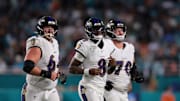 Oct 30, 2025; Miami Gardens, Florida, USA; Baltimore Ravens quarterback Lamar Jackson (8) runs up to the line with center Tyler Linderbaum (64) and offensive tackle Roger Rosengarten (70) during the third quarter against the Miami Dolphins at Hard Rock Stadium. Mandatory Credit: Sam Navarro-Imagn Images