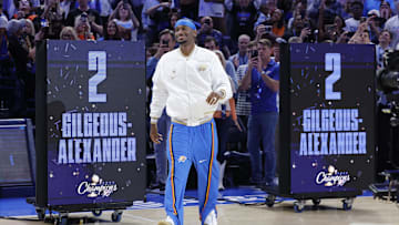 Oct 21, 2025; Oklahoma City, Oklahoma, USA; Oklahoma City Thunder guard Shai Gilgeous-Alexander walks onto the court during the championship ring and banner ceremony before the start of their game against the Houston Rockets at Paycom Center. Mandatory Credit: Alonzo Adams-Imagn Images