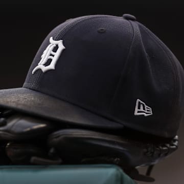 Jul 30, 2021; Detroit, Michigan, USA; The hat and glove of Detroit Tigers right fielder Robbie Grossman (8) sits on the ledge of the dugout during the first inning against the Baltimore Orioles at Comerica Park.