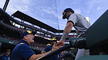 Sep 20, 2025; St. Louis, Missouri, USA; Milwaukee Brewers left fielder Jake Bauers (9) is congratulated by manager Pat Murphy (49) after scoring against the St. Louis Cardinals during the second inning at Busch Stadium. Mandatory Credit: Jeff Curry-Imagn Images