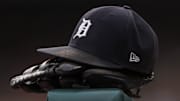 Jul 30, 2021; Detroit, Michigan, USA; The hat and glove of Detroit Tigers right fielder Robbie Grossman (8) sits on the ledge of the dugout during the first inning against the Baltimore Orioles at Comerica Park. 