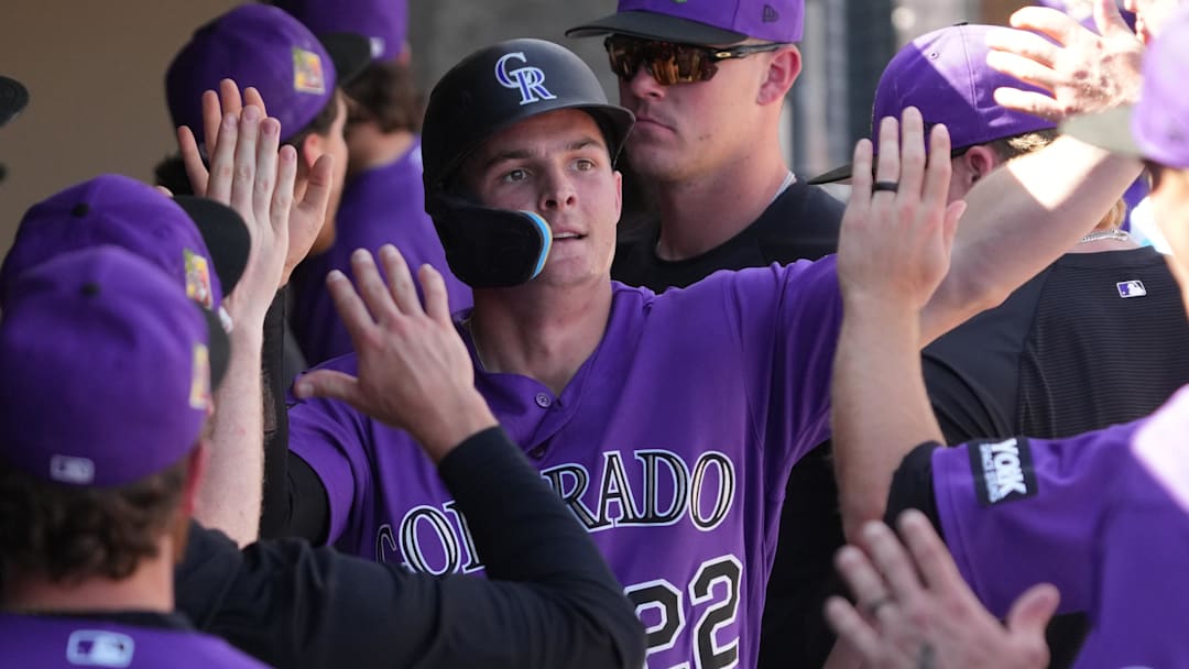 Mar 2, 2026; Salt River Pima-Maricopa, Arizona, USA; Colorado Rockies right fielder Mickey Moniak celebrates with teammates after hitting a solo home run against the Los Angeles Dodgers in the second inning at Salt River Fields at Talking Stick. Mandatory Credit: Rick Scuteri-Imagn Images