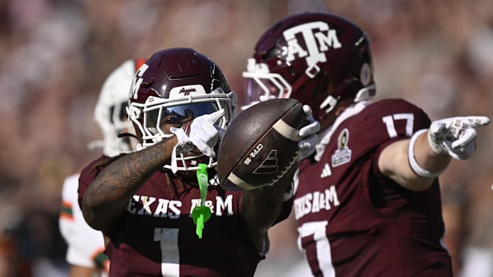 Dec 20, 2025; College Station, TX, USA; Texas A&M Aggies wide receiver Mario Craver (1) and Texas A&M Aggies tight end Theo Melin Öhrström (17) celebrate a first down against the Miami Hurricanes during the second half of the first round game of the CFP National Playoff at Kyle Field. Mandatory Credit: Jerome Miron-Imagn Images