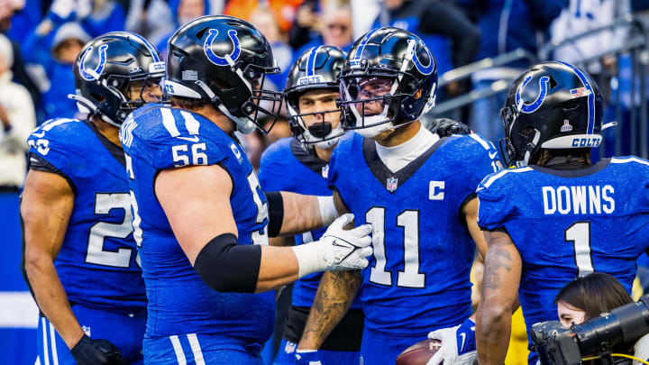 Indianapolis Colts wide receiver Michael Pittman Jr. (11) celebrates his touchdown with teammates in the second half against the Cleveland Browns at Lucas Oil Stadium.