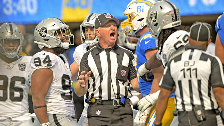 Sep 8, 2024; Inglewood, California, USA; Officials separate Las Vegas Raiders tight end Harrison Bryant (84) and Los Angeles Chargers tight end Will Dissly (81) after a fight in the second half at SoFi Stadium. Mandatory Credit: Jayne Kamin-Oncea-Imagn Images