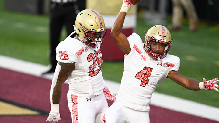 Nov 14, 2020; Chestnut Hill, Massachusetts, USA;  Boston College Eagles wide receiver Zay Flowers (4) celebrates with running back David Bailey (26) after scoring a touchdown against the Notre Dame Fighting Irish during the first half at Alumni Stadium.