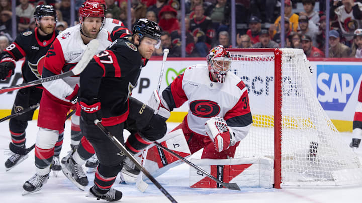 Apr 23, 2026; Ottawa, Ontario, CAN; Ottawa Senators left wing Warren Foegele (37) and Carolina Hurricanes goalie Frederik Andersen (31) follow the puck in the first period of game three of the first round of the 2026 Stanley Cup Playoffs at the Canadian Tire Centre. Mandatory Credit: Marc DesRosiers-Imagn