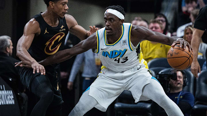 Apr 10, 2025; Indianapolis, Indiana, USA; Indiana Pacers forward Pascal Siakam (43) dribbles the ball while Cleveland Cavaliers forward De'Andre Hunter (12) defends in the first half at Gainbridge Fieldhouse. Mandatory Credit: Trevor Ruszkowski-Imagn Images