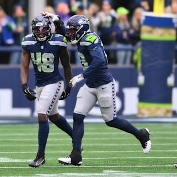 Nov 24, 2024; Seattle, Washington, USA; Seattle Seahawks linebacker Tyrice Knight (48) celebrates after sacking Arizona Cardinals quarterback Kyler Murray (1) (not pictured) during the first half at Lumen Field. 