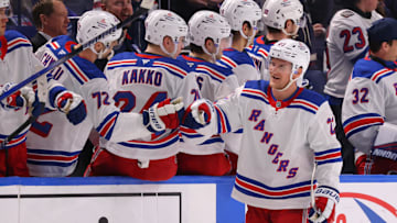 Dec 11, 2024; Buffalo, New York, USA;  New York Rangers defenseman Adam Fox (23) celebrates his goal with teammates during the third period against the Buffalo Sabres at KeyBank Center. Mandatory Credit: Timothy T. Ludwig-Imagn Images