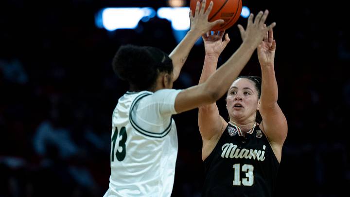 Miami RedHawks guard Tamar Singer (13) hits a 3-point basket over Ohio Bobcats guard Monica Williams (13) in the first quarter of the NCAA Basketball game at Millett Hall in Oxford, Ohio, on Saturday, January 31, 2026.