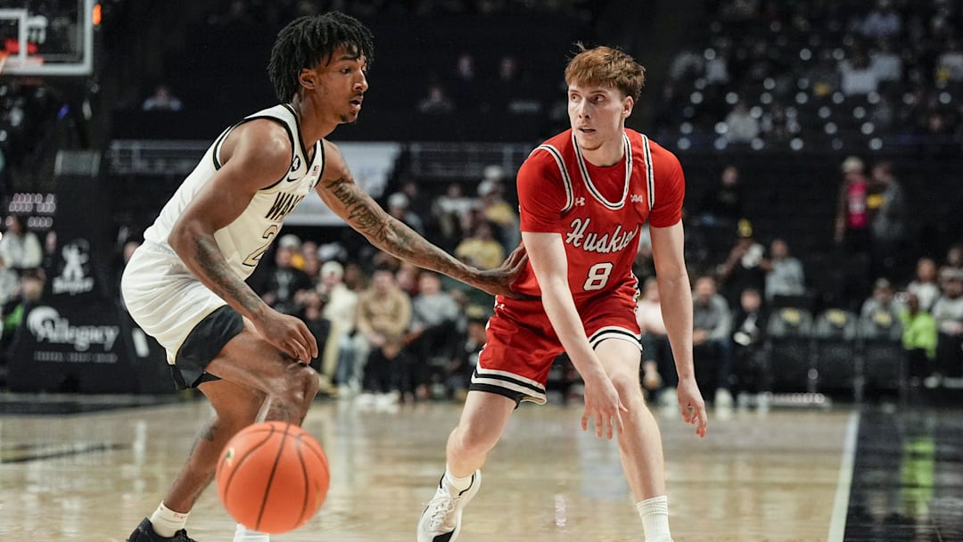 Nov 28, 2025; Winston-Salem, North Carolina, USA;  Northeastern Huskies guard William Kermoury (8) passes the ball defended by Wake Forest Demon Deacons guard Juke Harris (2) during the second half at Lawrence Joel Veterans Memorial Coliseum. Mandatory Credit: Jim Dedmon-Imagn Images