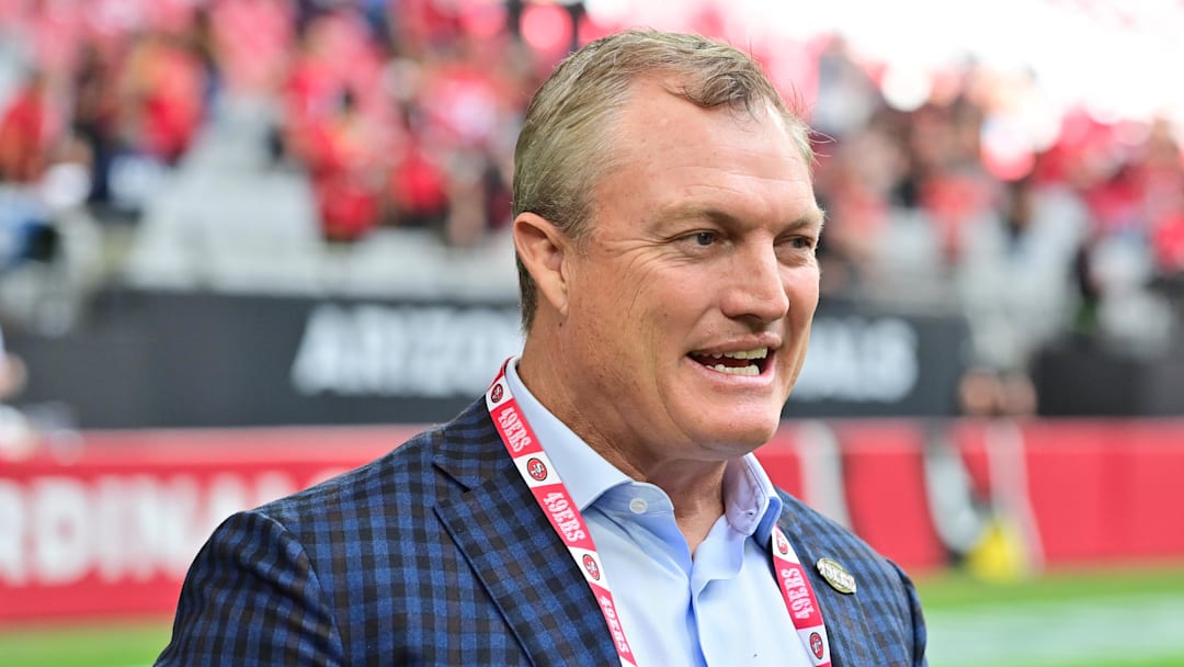 Nov 16, 2025; Glendale, Arizona, USA; San Francisco 49ers general manager John Lynch speaks on the sidelines before the game against the Arizona Cardinals at State Farm Stadium. Mandatory Credit: Matt Kartozian-Imagn Images