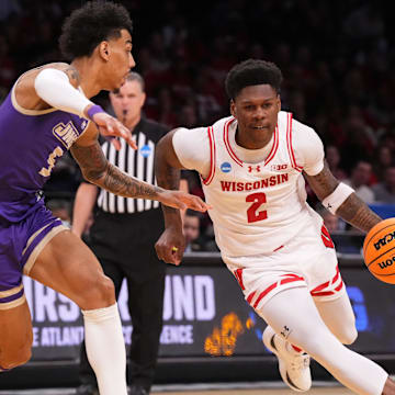 Mar 22, 2024; Brooklyn, NY, USA; Wisconsin Badgers guard AJ Storr (2) dribbles the ball against James Madison Dukes guard Terrence Edwards Jr. (5) in the first round of the 2024 NCAA Tournament at the Barclays Center.  Mandatory Credit: Robert Deutsch-Imagn Images