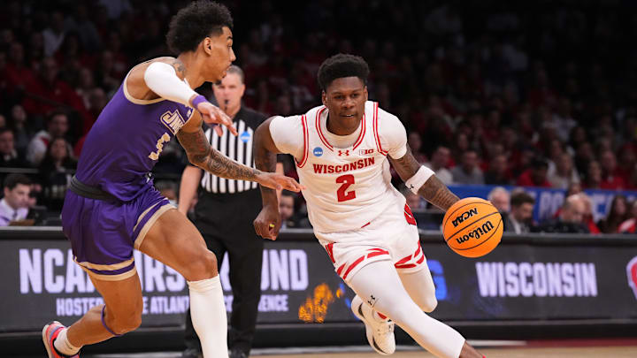 Mar 22, 2024; Brooklyn, NY, USA; Wisconsin Badgers guard AJ Storr (2) dribbles the ball against James Madison Dukes guard Terrence Edwards Jr. (5) in the first round of the 2024 NCAA Tournament at the Barclays Center.  Mandatory Credit: Robert Deutsch-Imagn Images