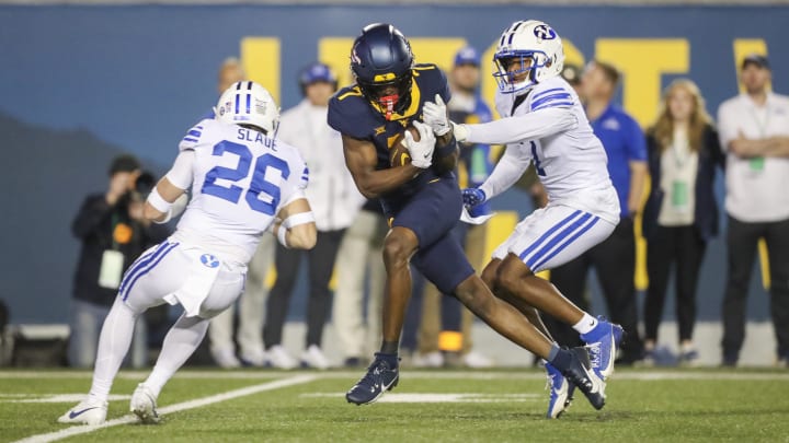 Nov 4, 2023; Morgantown, West Virginia, USA; West Virginia Mountaineers wide receiver Traylon Ray fight for a first down against BYU.