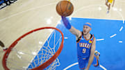 Jun 22, 2025; Oklahoma City, Oklahoma, USA; Oklahoma City Thunder guard Alex Caruso (9) dunks against the Indiana Pacers during the first half of game seven of the 2025 NBA Finals at Paycom Center. Mandatory Credit: Kyle Terada-Imagn Images