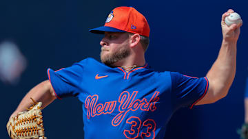 Feb 15, 2025; Port St. Lucie, FL, USA; New York Mets pitcher A.J. Minter (33) pitches during a spring training workout at Clover Park. Mandatory Credit: Sam Navarro-Imagn Images