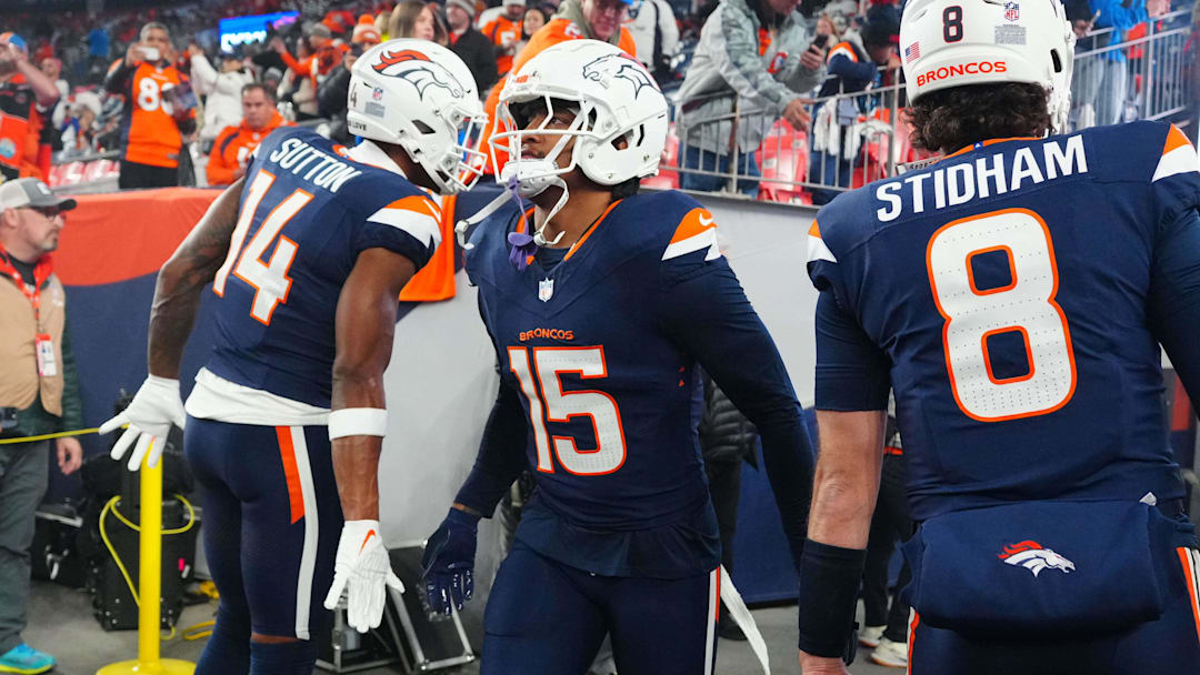 Dec 2, 2024; Denver, Colorado, USA; Denver Broncos wide receiver Courtland Sutton (14), linebacker Nik Bonitto (15), and quarterback Jarrett Stidham (8) before the game against the Cleveland Browns at Empower Field at Mile High. Dec 2, 2024; Denver, Colorado, USA; Denver Broncos wide receiver Courtland Sutton (14), linebacker Nik Bonitto (15), and quarterback Jarrett Stidham (8) before the game against the Cleveland Browns at Empower Field at Mile High.