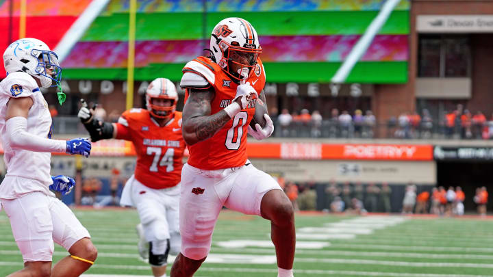 Oklahoma State's Ollie Gordon II (0) scores a touchdown in the first half of the college football game between the Oklahoma State Cowboys and South Dakota State Jackrabbits at Boone Pickens Stadium in Stillwater, Okla., Saturday, Aug., 31, 2024.