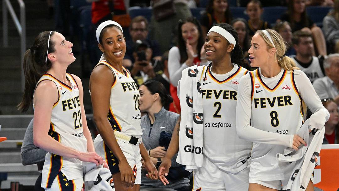 Aug 23, 2026; Chicago, Illinois, USA;  Indiana Fever guard Caitlin Clark (22), forward Monique Billings (25), forward Myisha Hines-Allen (2) and guard Sophie Cunningham (8) celebrate from the bench against the Chicago Sky during the second half at Wintrust Arena.  Mandatory Credit: Patrick Gorski-Imagn Images