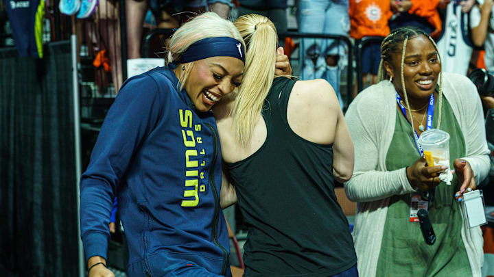 Dallas Wings guard DiJonai Carrington hugs guard Paige Bueckers before a game against the Connecticut Sun Dallas Wings guard DiJonai Carrington hugs guard Paige Bueckers before a game against the Connecticut Sun