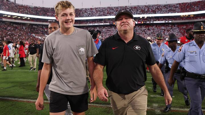 Oct 18, 2025; Athens, Georgia, USA; Georgia Bulldogs head coach Kirby Smart with his son Andrew Smart after the game against the Mississippi Rebels at Sanford Stadium. Mandatory Credit: Brett Davis-Imagn Images
