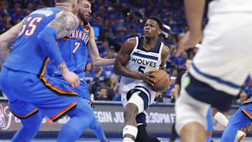May 22, 2025; Oklahoma City, Oklahoma, USA; Minnesota Timberwolves guard Anthony Edwards (5) drives against Oklahoma City Thunder forward Chet Holmgren (7) in the third quarter during game two of the western conference finals for the 2025 NBA Playoffs at Paycom Center. Mandatory Credit: Alonzo Adams-Imagn Images