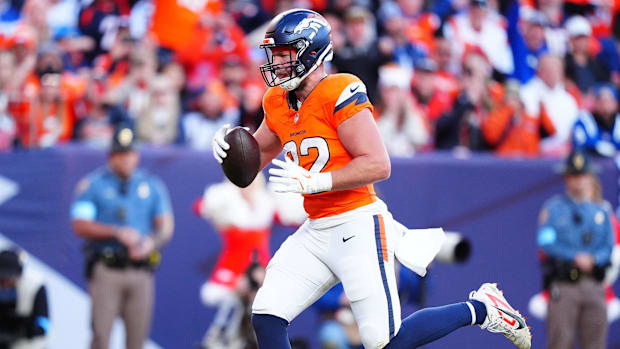 Denver Broncos tight end Adam Trautman (82) scores a touchdown against the Indianapolis Colts at Empower Field at Mile High.