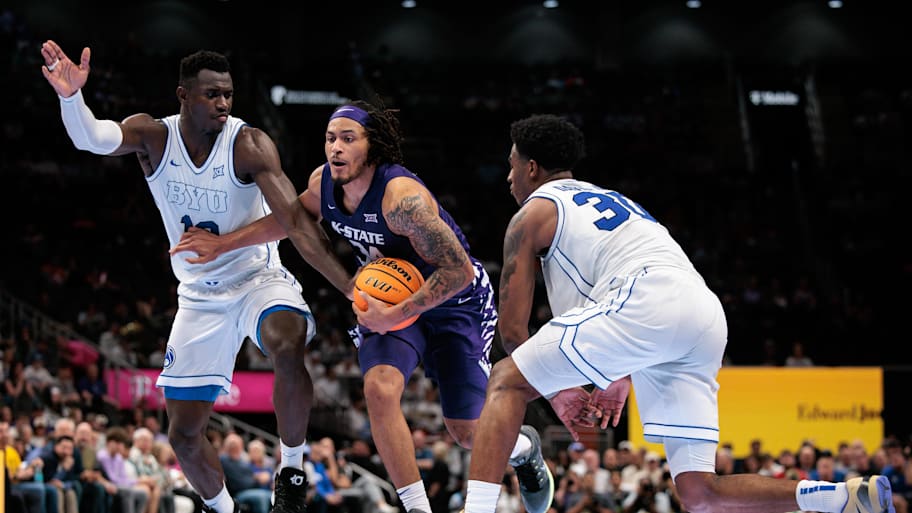 Kansas State guard Nate Johnson drives to the basket around BYU forward Keba Keita during the Big 12 tournament on Tuesday.