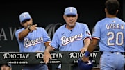 Aug 24, 2025; Arlington, Texas, USA; Texas Rangers manager Bruce Bochy (15) and second baseman Ezequiel Duran (20) celebrate after Duran scores against the Cleveland Guardians during the fourth inning at Globe Life Field. Mandatory Credit: Jerome Miron-Imagn Images