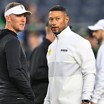 Oct 14, 2023; South Bend, Indiana, USA; USC Trojans head coach Lincoln Riley and Notre Dame Fighting Irish head coach Marcus Freeman chat before the game at Notre Dame Stadium. 