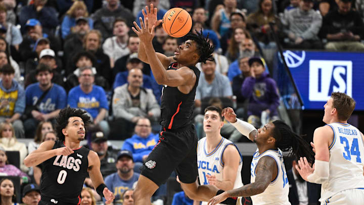 Gonzaga Bulldogs guard Michael Ajayi (1) tries to grab a rebound over teammate Bulldogs guard Ryan Nembhard (0), UCLA Bruins Lazar Stefanovic (10), Sebastian Mack (12) and Tyler Bilodeau (34)